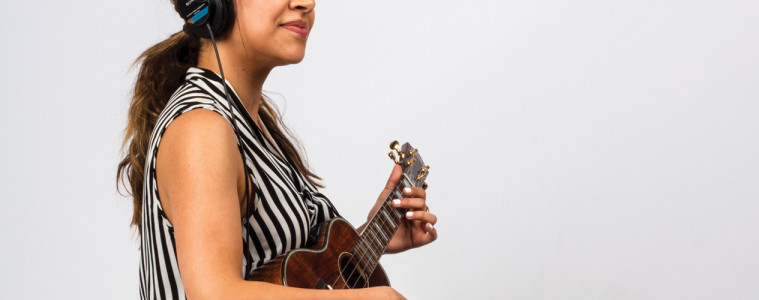 Woman Playing Ukulele Magazine for Get Off the Page and Play by Ear ukulele lesson