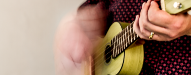 yellow ukulele strumming