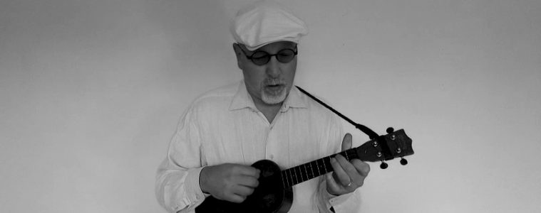 Eddie Scher playing jazz ukulele black and white photo