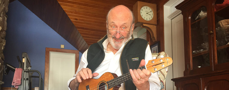 Noel Paul Stookey of Peter, Paul and Mary smiling and holding a ukulele