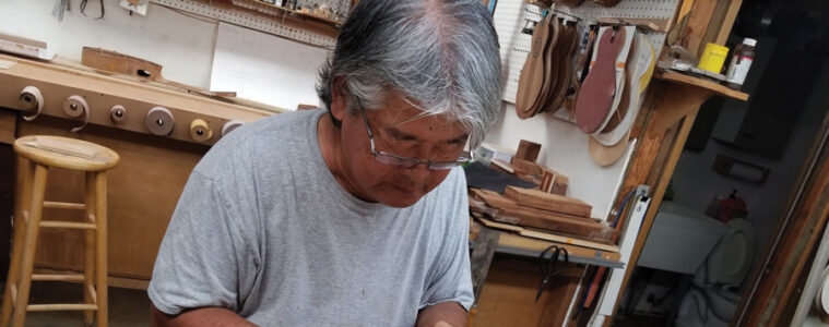 Ukulele Guild of Hawaii founder Mike Chock making a ukulele
